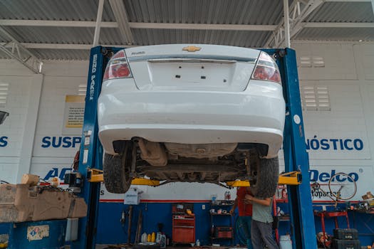 mechanic checking car tires