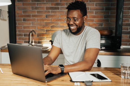 a person working on a laptop at home