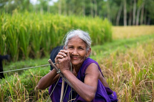 happy farmer in a green field